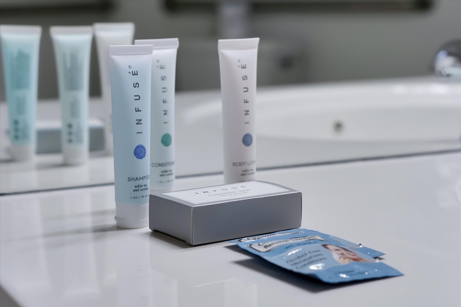 Premium toiletries await on your bathroom counter, with luxury shampoo, conditioner, and body lotion for your pampering ritual.