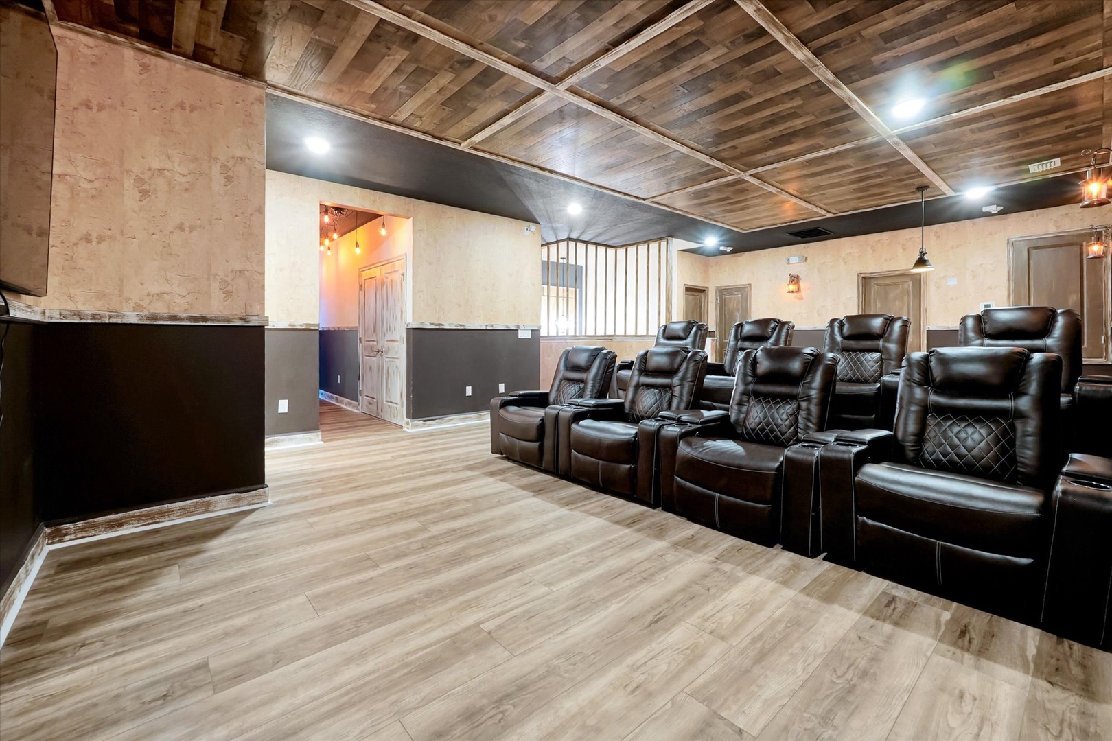Sink into plush leather recliners and enjoy movie night in your private theater, complete with stadium seating and ambient lighting for the ultimate cinematic escape.