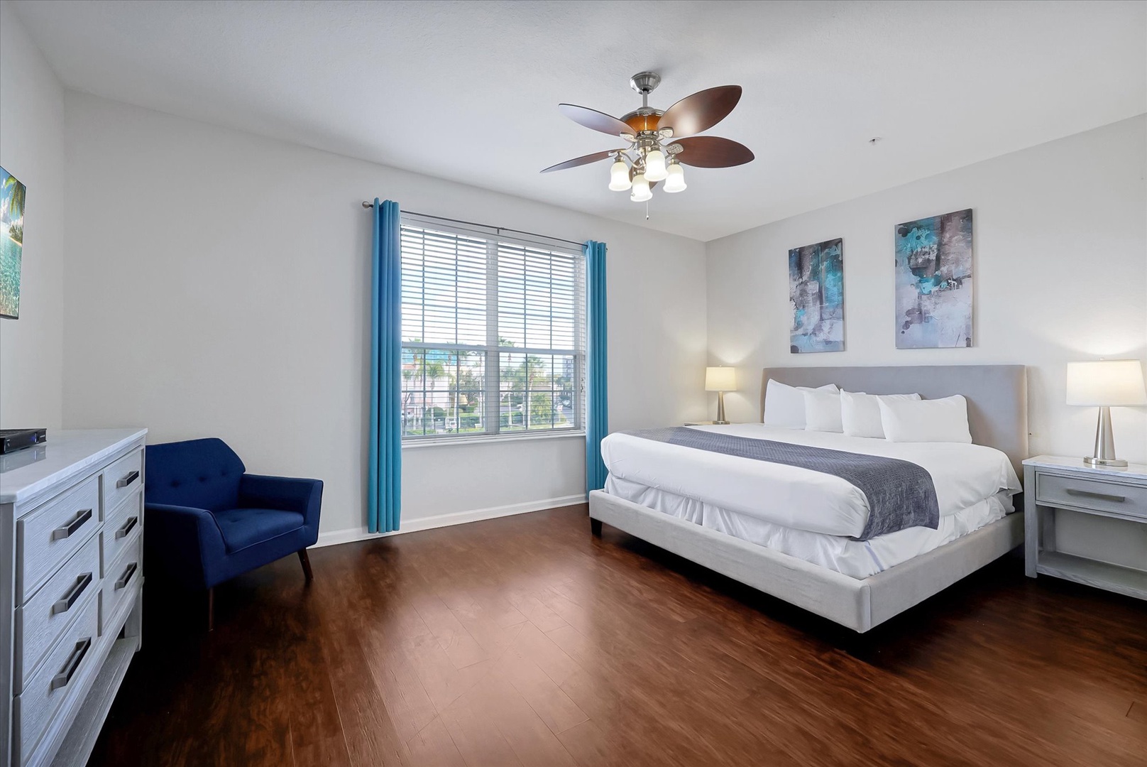 Sink into comfort with crisp linens and modern touches in your spacious bedroom retreat.