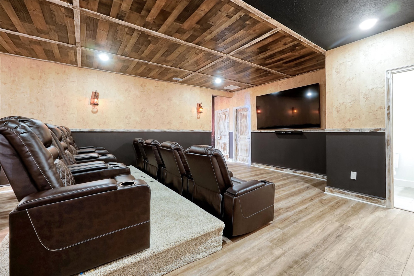 Sink into plush recliners and enjoy movie nights in your private home theater, complete with stadium seating and a big screen for unforgettable entertainment.