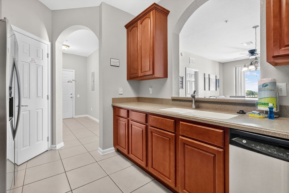 Your fully equipped kitchen features warm wood cabinets, granite countertops, and stainless appliances for effortless meal preparation.