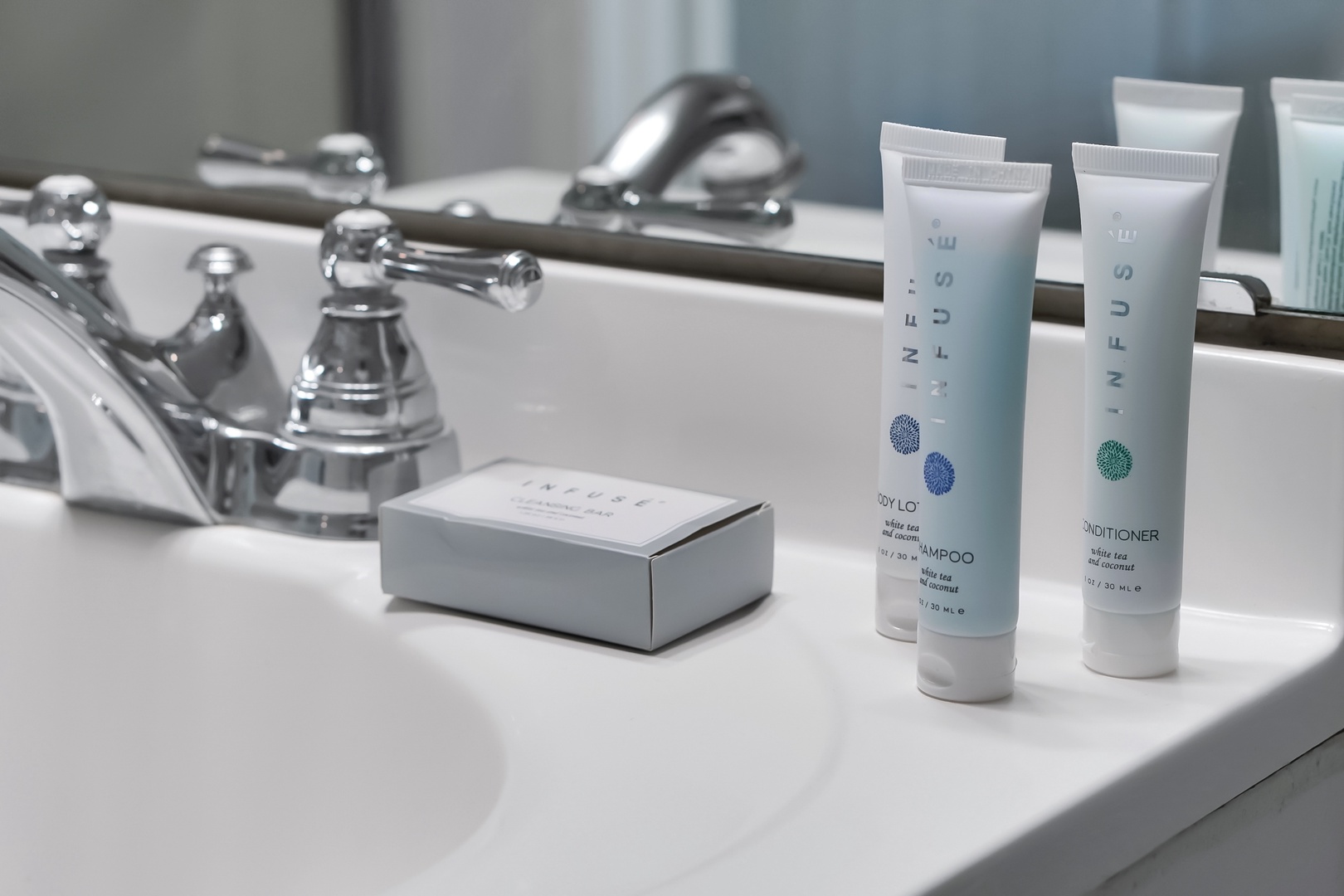 Pamper yourself with premium amenities—luxury toiletries await your arrival in this spotless bathroom.