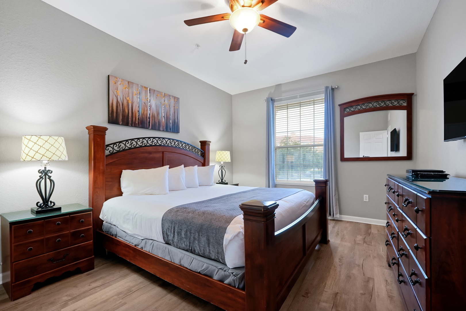 Slip into crisp linens and plush pillows in your peaceful bedroom retreat. Vaulted ceilings, elegant wood furnishings, and soft lighting create a cozy haven for restful nights after your adventures.