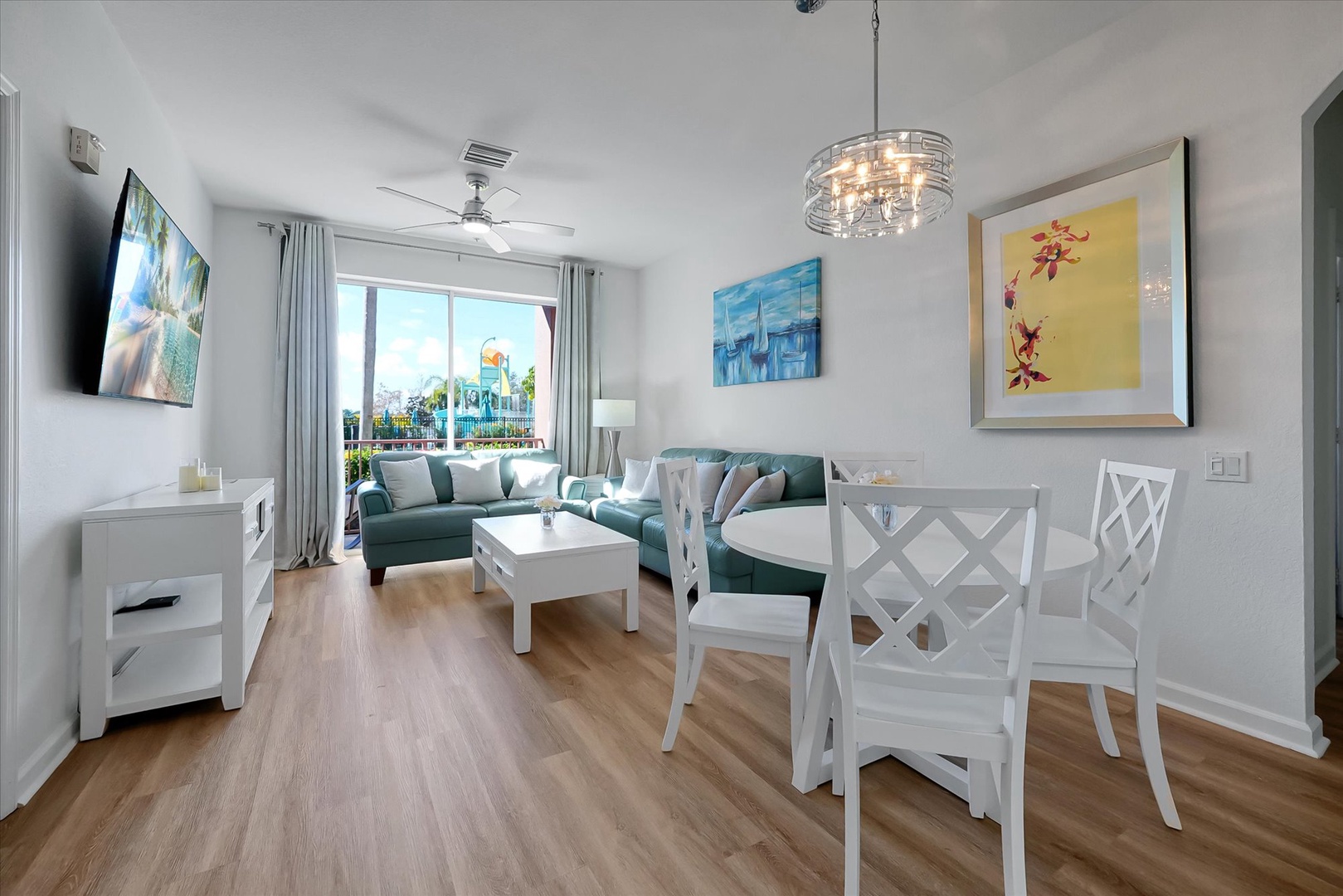 Relax in your bright, modern living space with cozy seating and vibrant artwork that brings tropical charm to your stay.