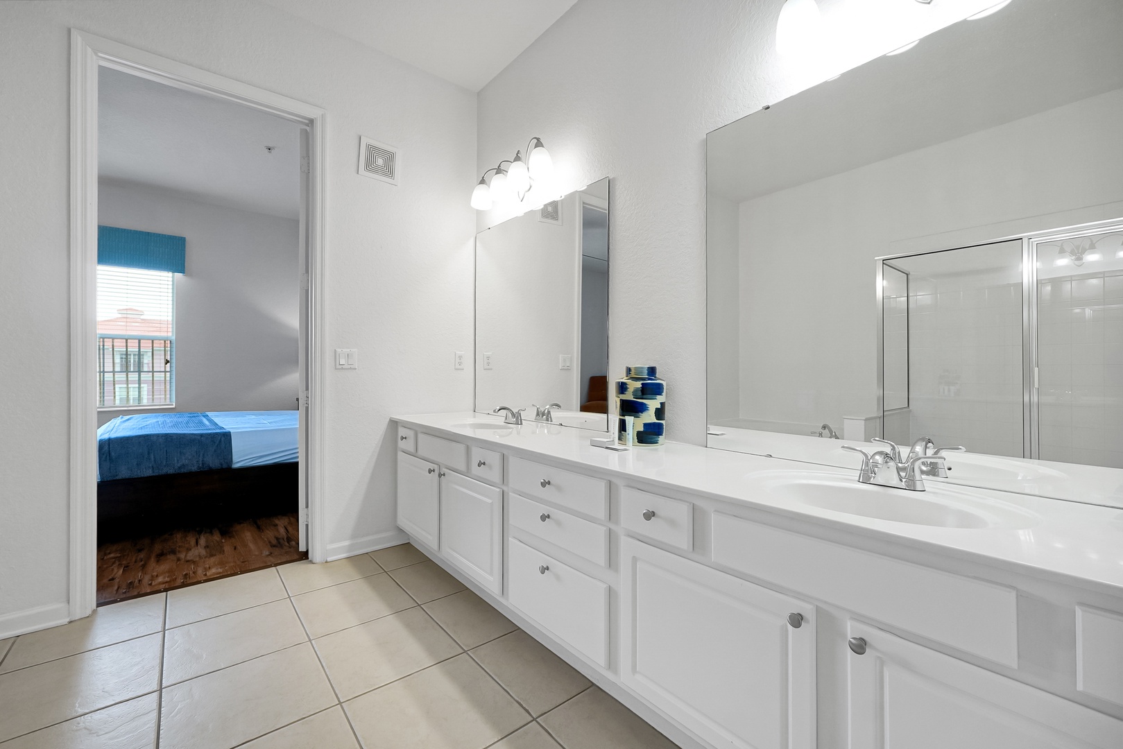Your spacious bathroom offers dual vanities with plenty of counter space and bright lighting—perfect for getting ready each morning in comfort.