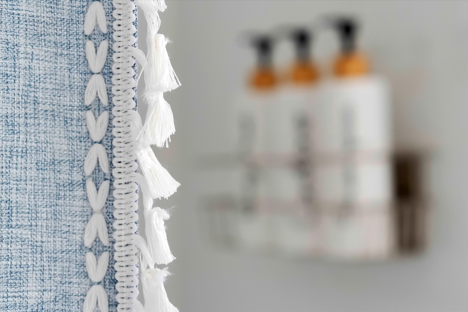 Indulge in luxurious bath amenities thoughtfully arranged for your relaxation, with soft linens adding comfort to your spa-like experience.