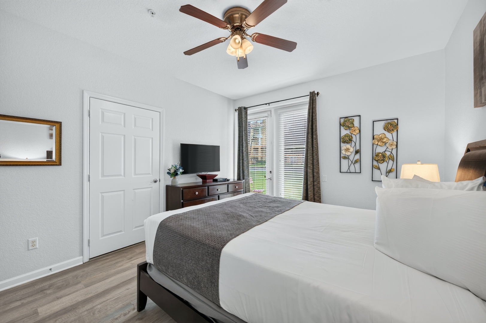 Sink into soft linens and let the ceiling fan drift you to sleep. Your peaceful bedroom retreat awaits with warm natural light and all the comfort you need to truly unwind.