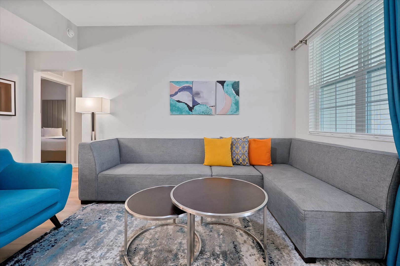 Settle into your cozy living space with plush sectional seating and vibrant pops of color that create the perfect atmosphere for relaxation.