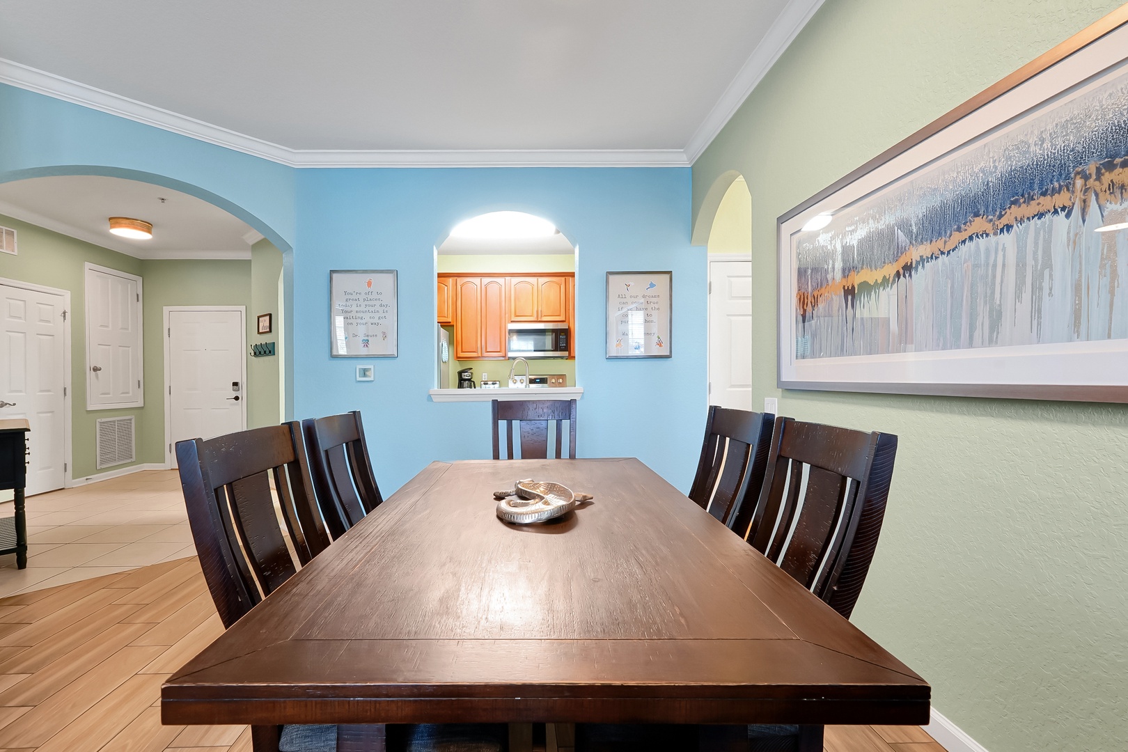 Gather around this elegant dining table for memorable meals with your group in this bright, welcoming space.