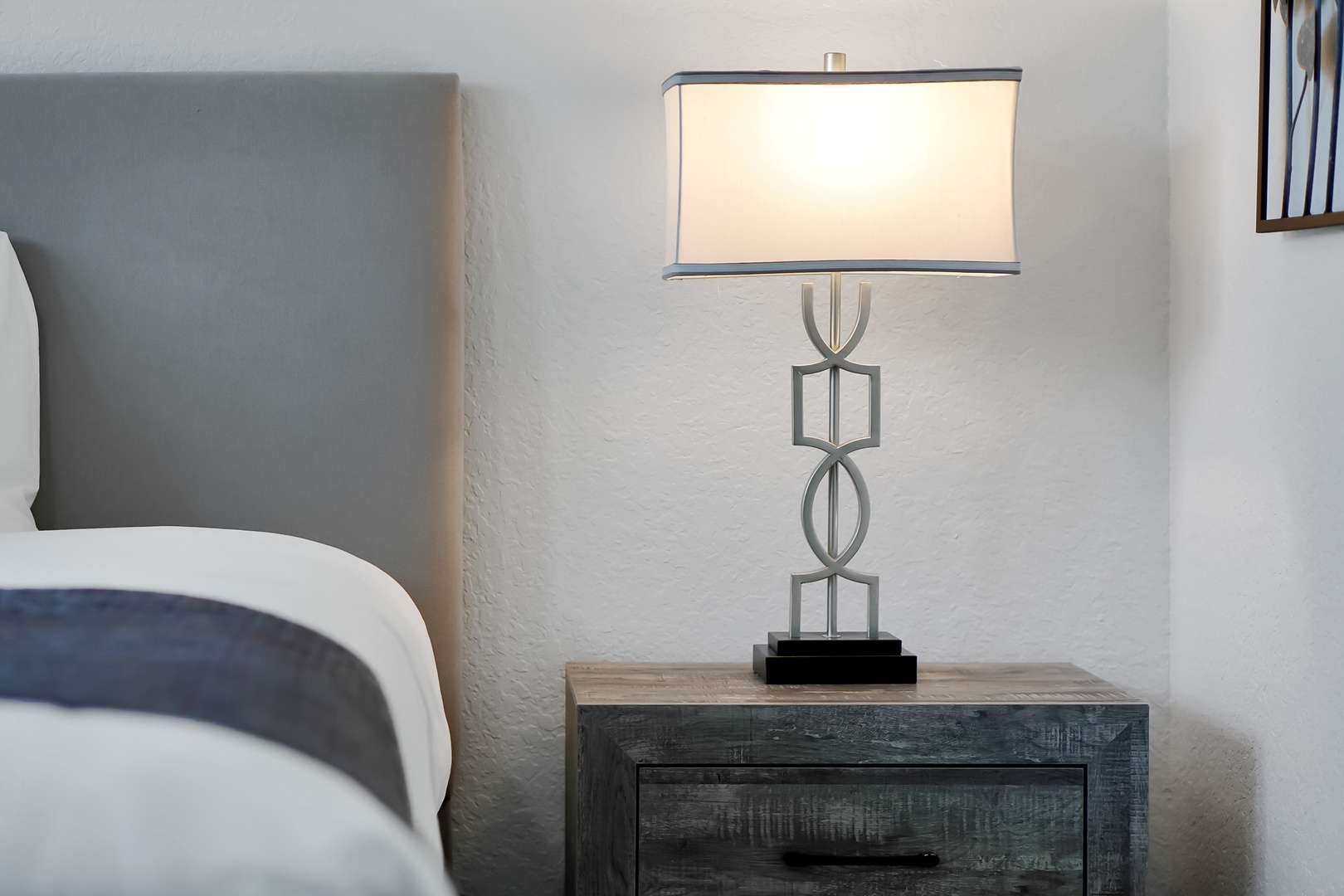 Settle into your cozy bedroom with stylish furnishings and warm lighting for restful nights.