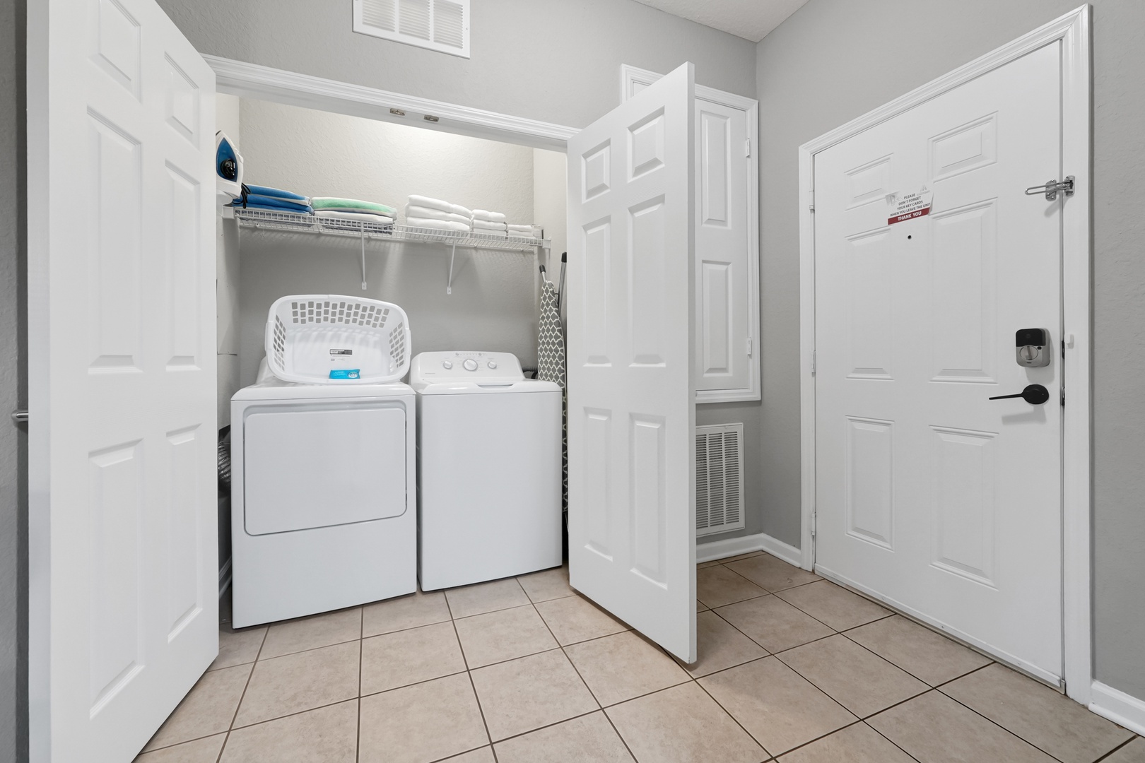 Your in-unit laundry closet keeps fresh clothes and linens conveniently at hand throughout your stay, with a full-size washer and dryer plus storage space above.