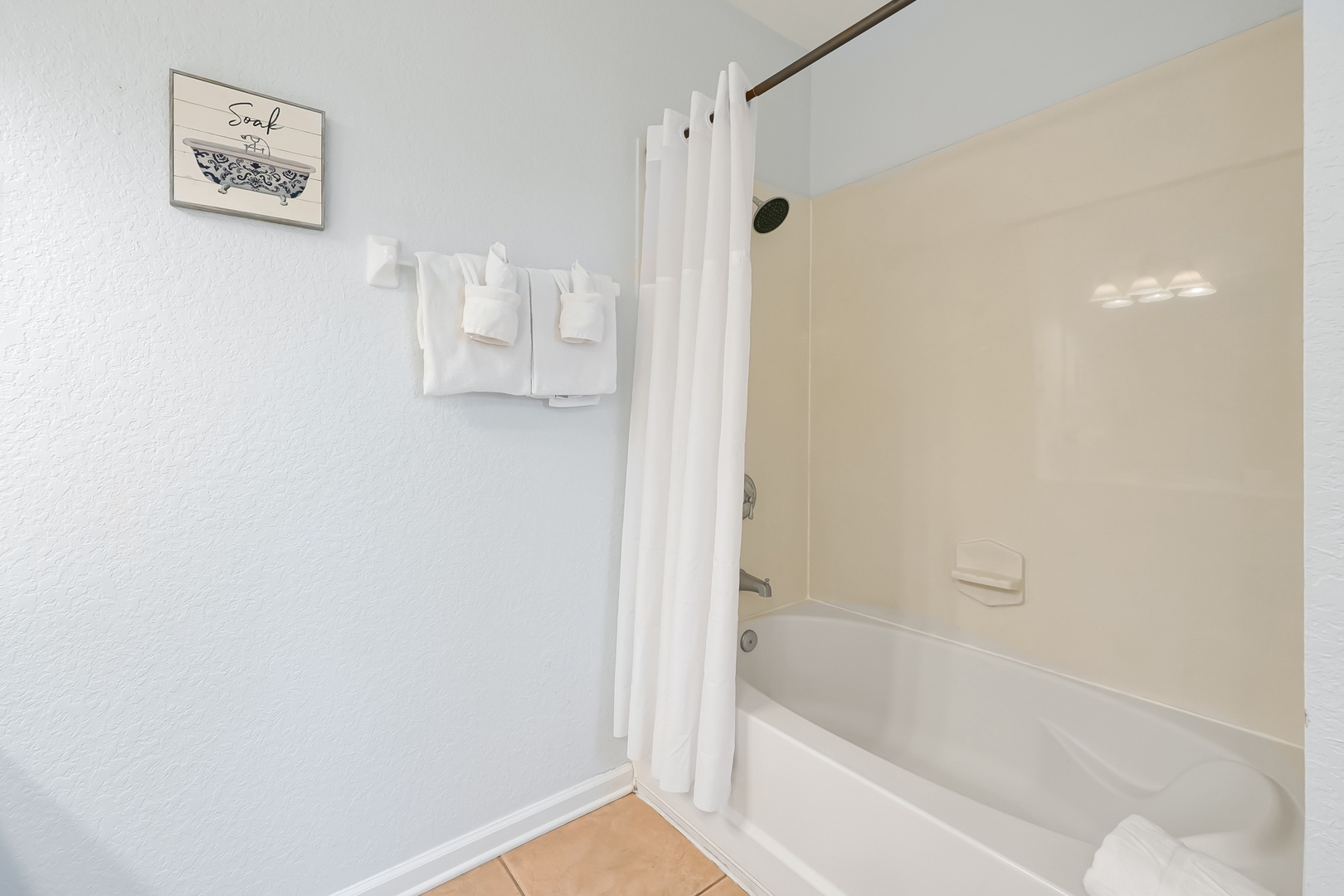 Your private bathroom features a spacious tub-shower combo with fresh towels and thoughtful touches for your comfort.