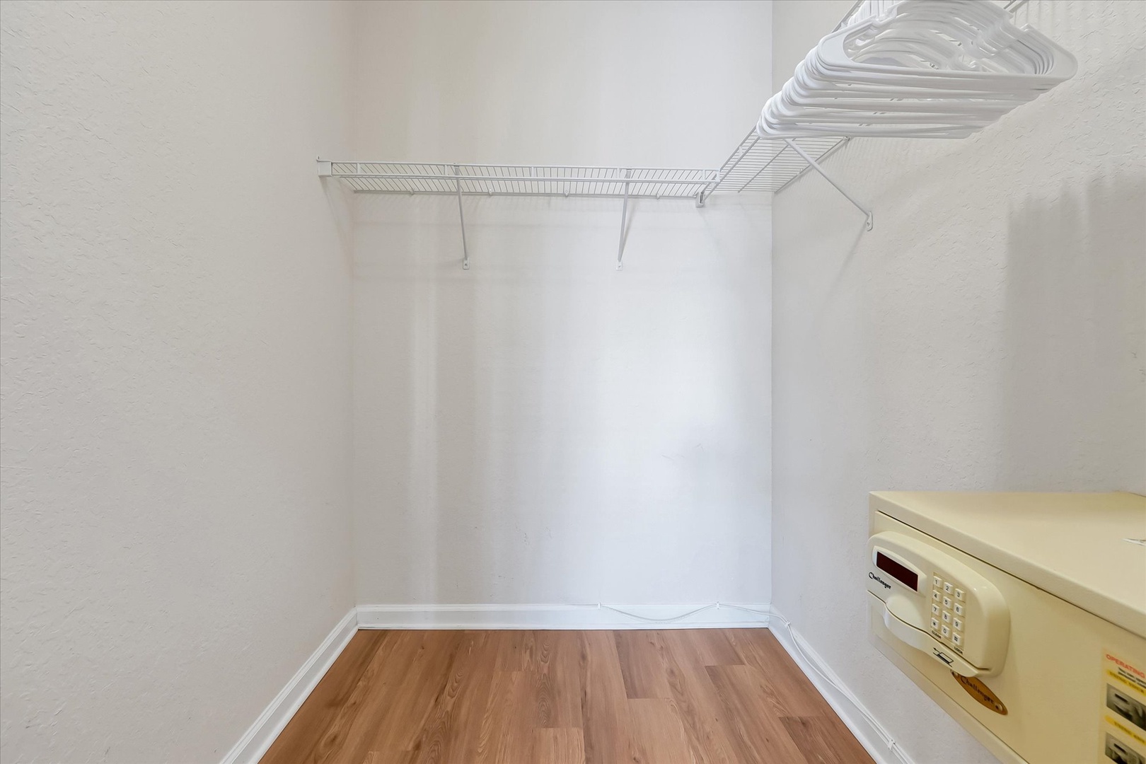 Your walk-in closet offers generous hanging space and a convenient in-room safe for valuables.