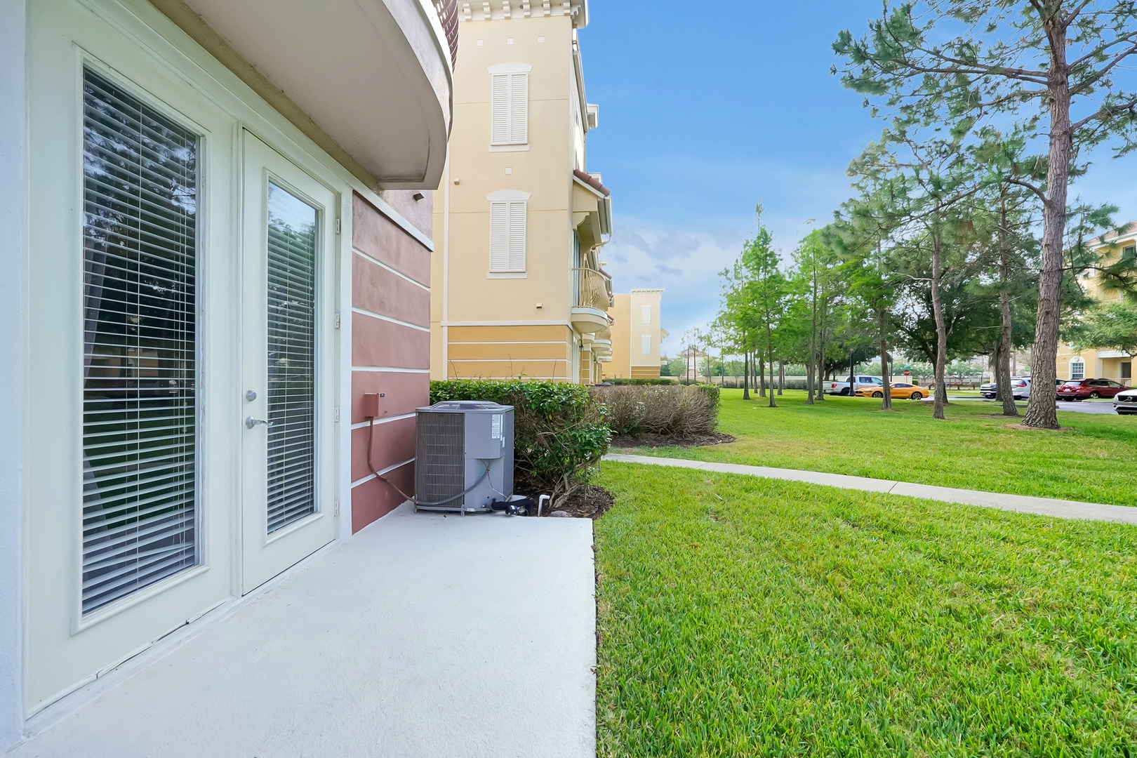 Step onto your private ground-level patio overlooking manicured lawns and tree-lined walkways in this peaceful residential community.