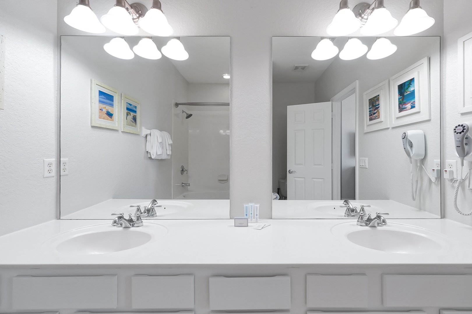 Freshen up in your spacious dual-sink bathroom with premium lighting and thoughtful amenities for your morning routine.