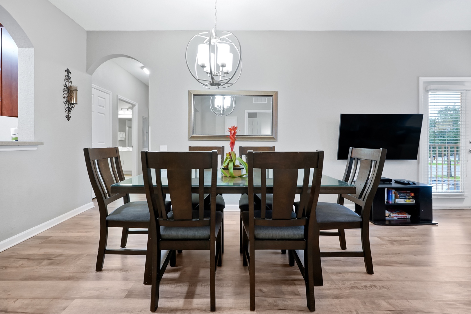 Gather around the spacious dining table where memories are made over shared meals. Modern pendant lighting and elegant decor create the perfect setting for your breakfast conversations and evening dinners.