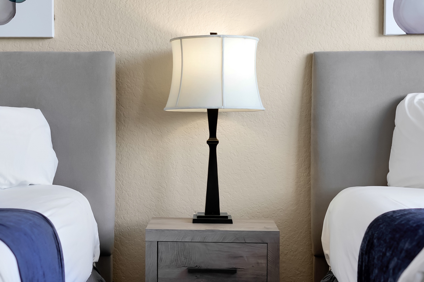 Rest easy in your comfortable twin beds with soft linens and warm bedside lighting for the perfect night's sleep.