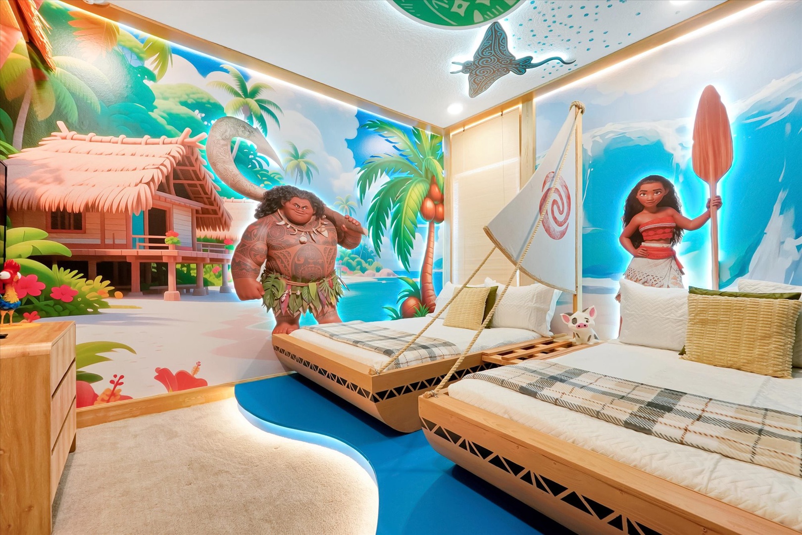 A whimsical tropical-themed bedroom featuring boat-shaped twin beds with sail details, vibrant island murals, and playful character artwork—perfect for young adventurers ready to set sail on dream-filled voyages.