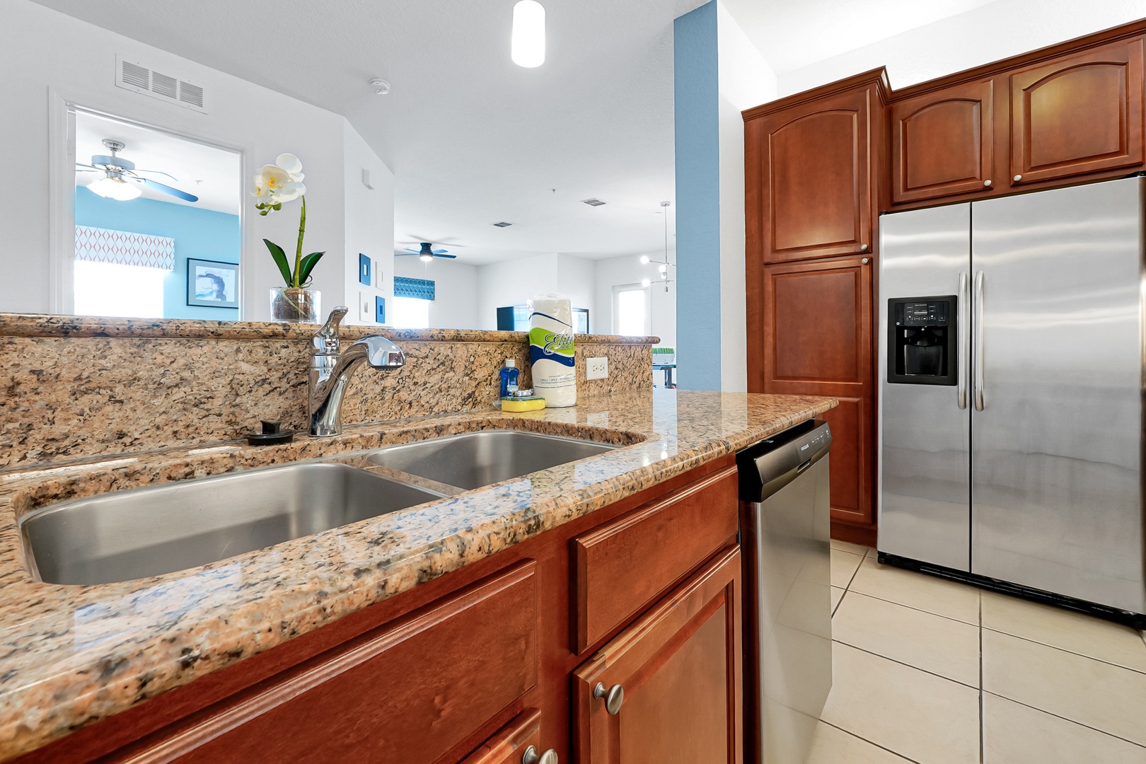Your fully equipped kitchen features granite counters, stainless appliances, and an open layout that flows effortlessly into the living spaces—perfect for preparing meals while staying connected with family.