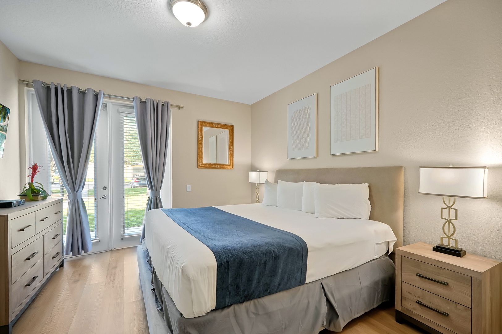 Sink into crisp white linens and soft pillows in your peaceful bedroom retreat, complete with elegant furnishings and natural light.