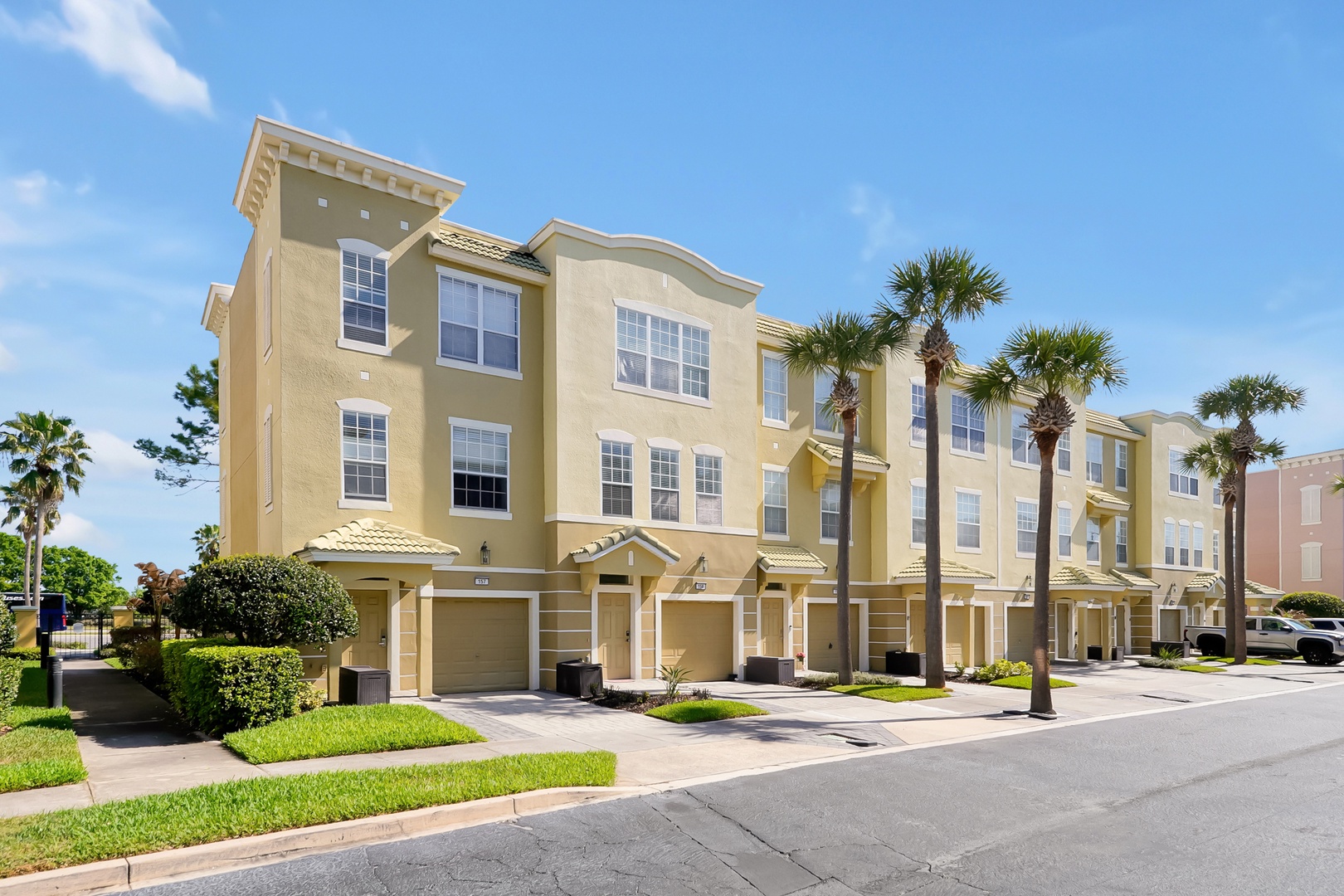 Modern townhomes in a well-maintained community with tropical landscaping and convenient parking for your Florida getaway.
