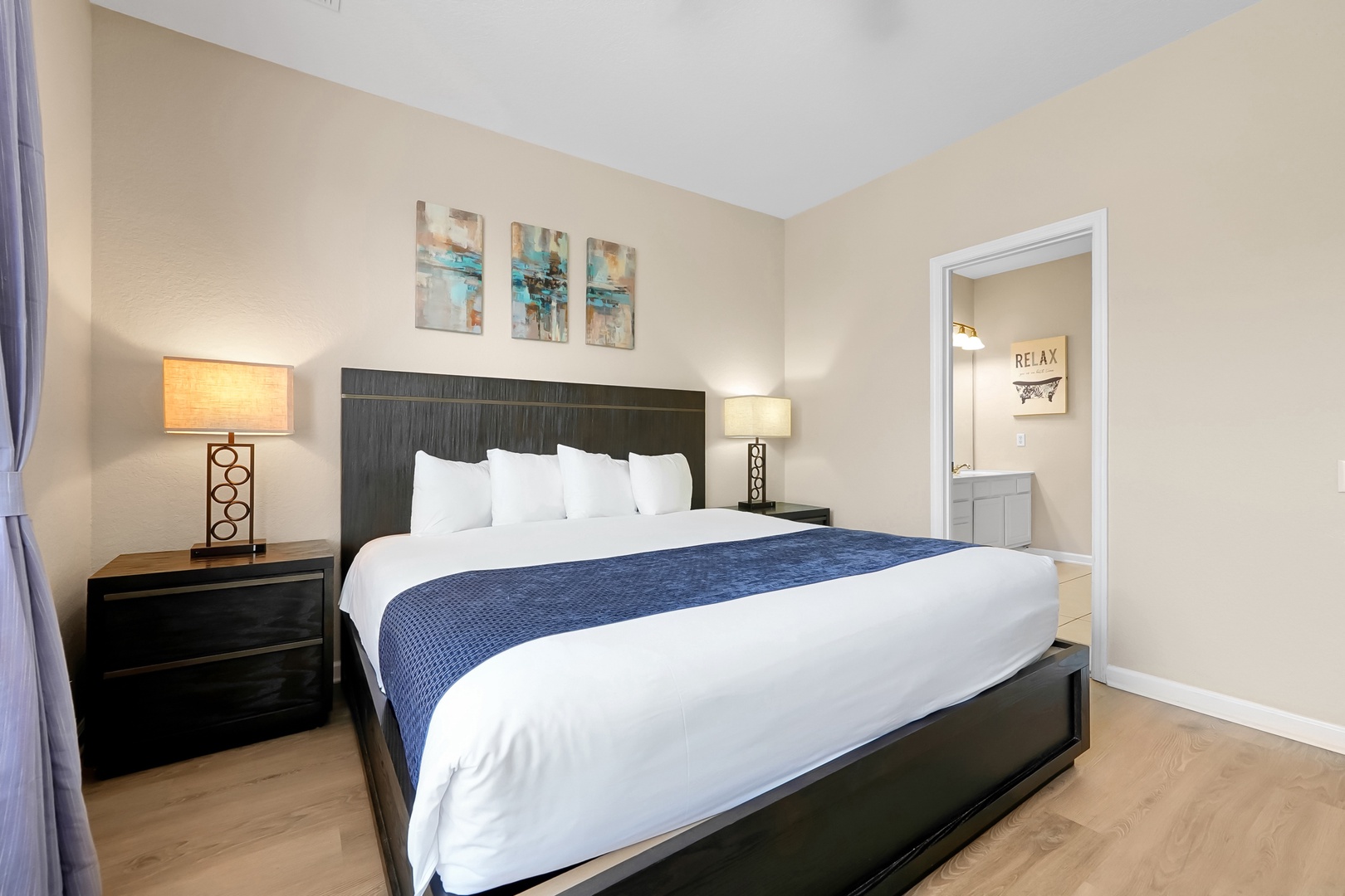 Sink into plush white linens and let the soft bedside lighting create your perfect atmosphere for rest and relaxation.