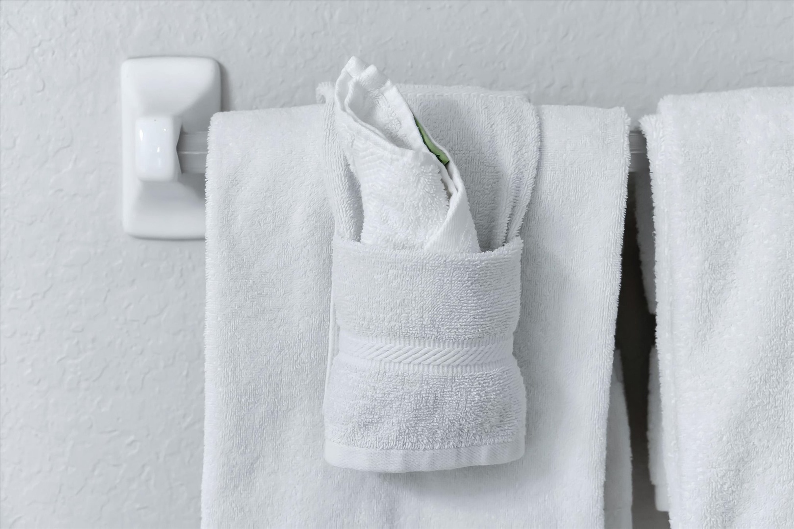 Fresh, fluffy towels await your arrival, thoughtfully arranged for your comfort and convenience.