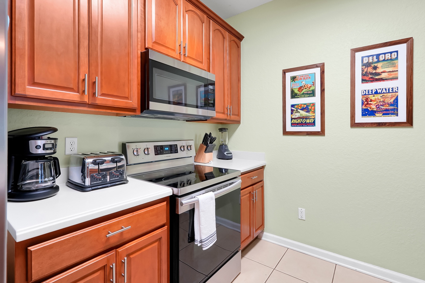 Your fully-equipped kitchen awaits with modern appliances, warm wood cabinets, and everything you need to prepare meals during your stay.