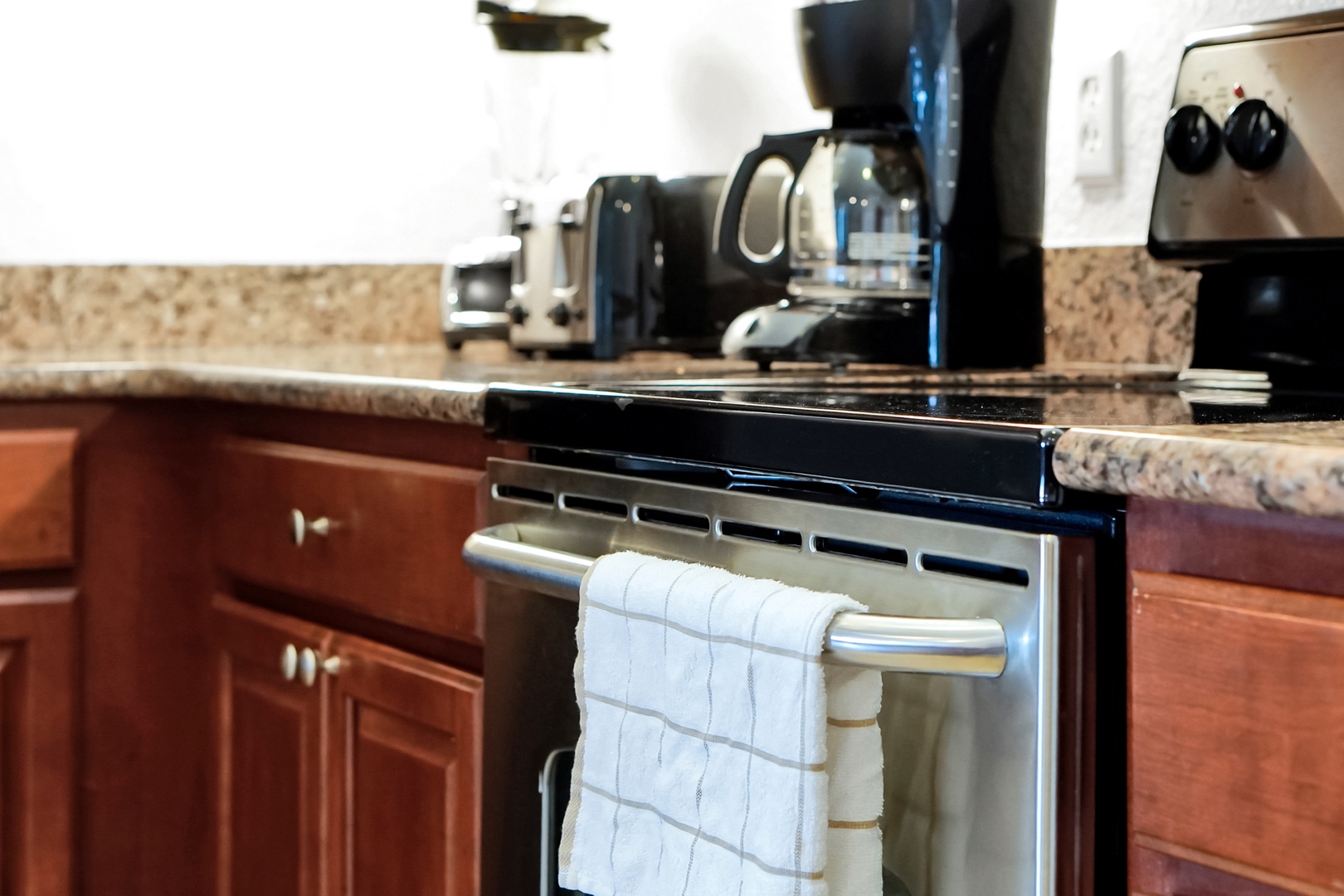 Your kitchen is ready for morning coffee or homemade meals, with a full stove, coffee maker, and all the essentials waiting for you.