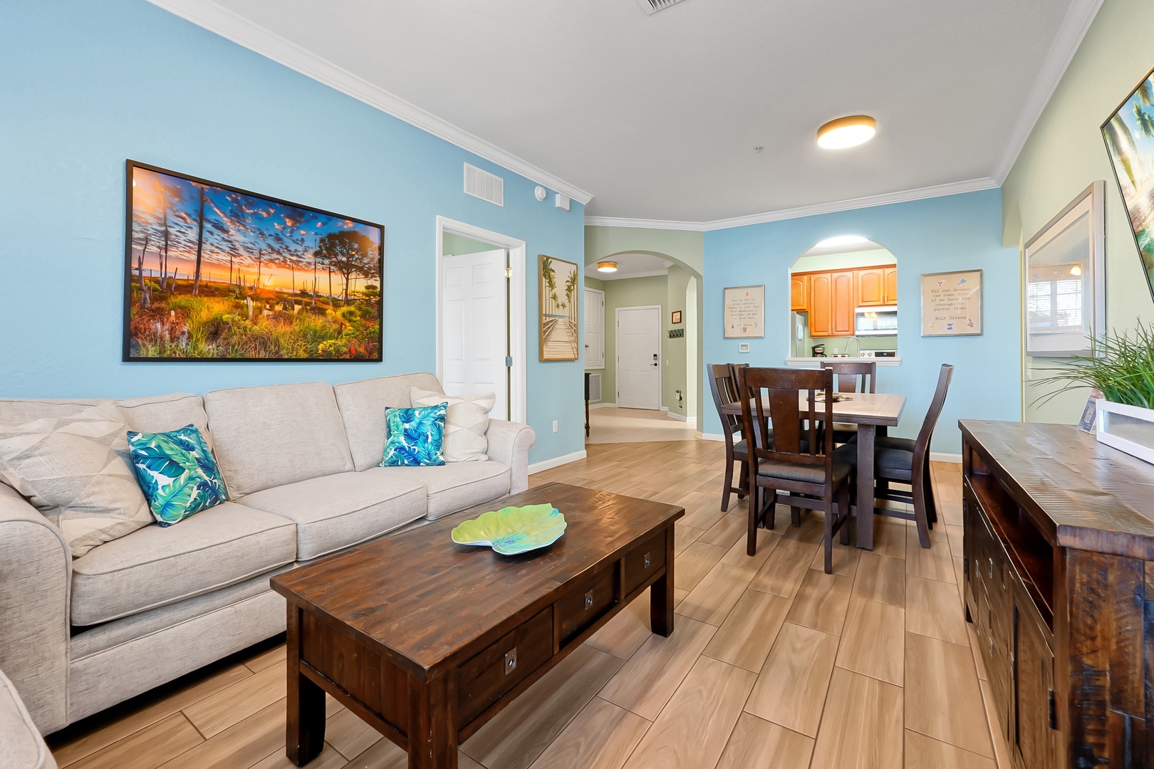 Relax in your bright, open living space with comfortable seating and coastal colors that perfectly complement the beautiful hardwood floors throughout.