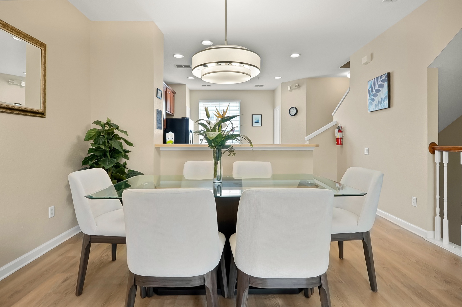 Gather around your elegant glass dining table for memorable meals in this modern, light-filled space with stylish seating for six.