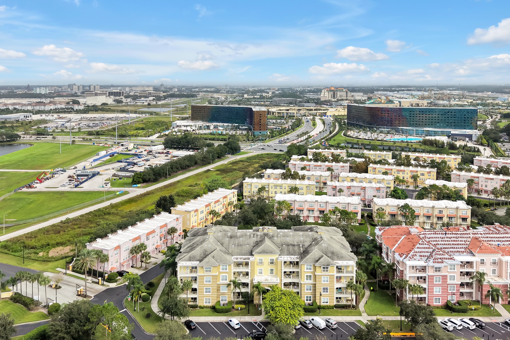 Aerial view of the property and surrounding neighborhood, showcasing nearby residential complexes and modern developments in the area.