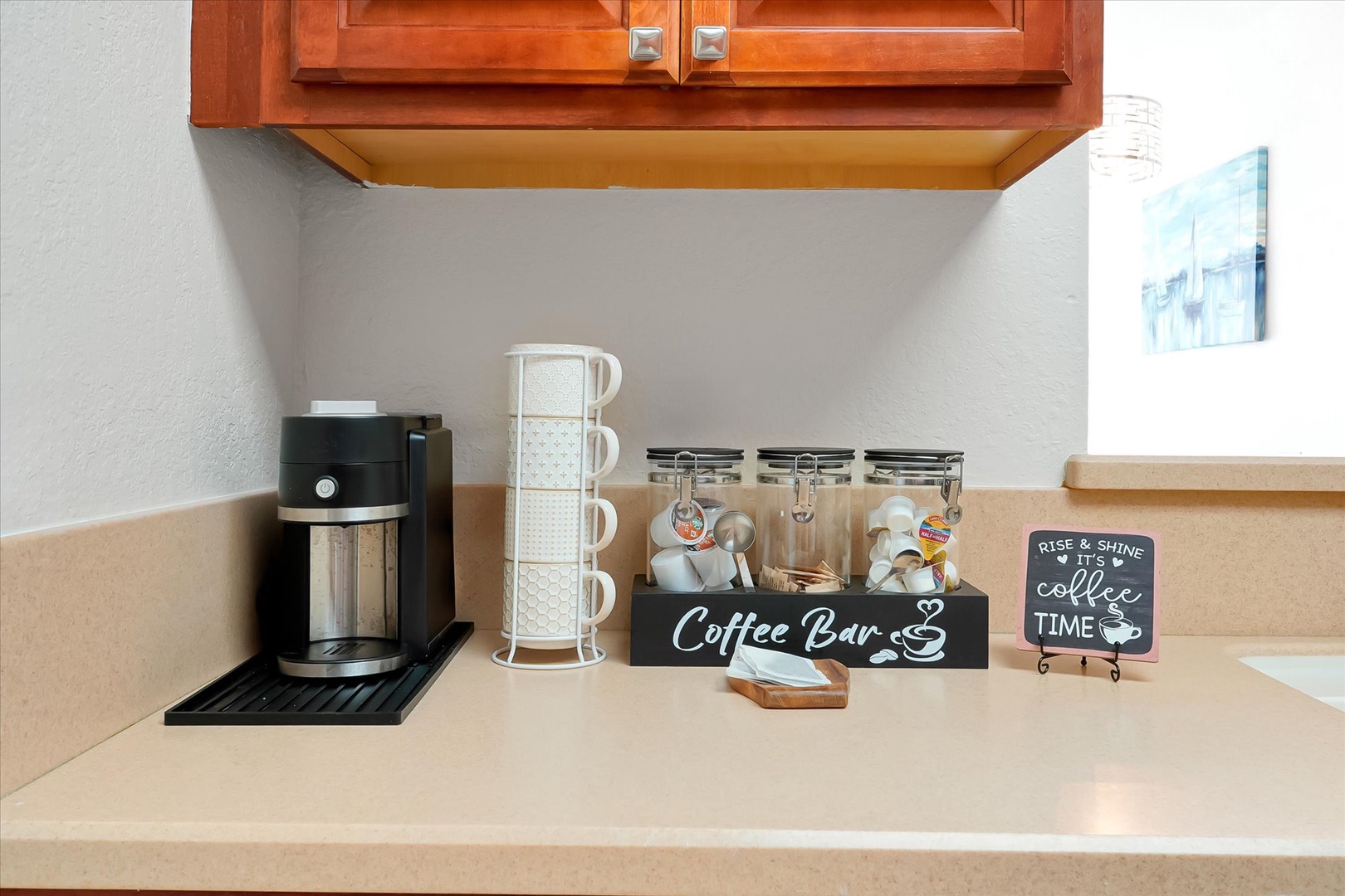 Start your mornings right with this thoughtfully curated coffee bar, complete with premium machine, stylish mugs, and all the essentials for your perfect cup.