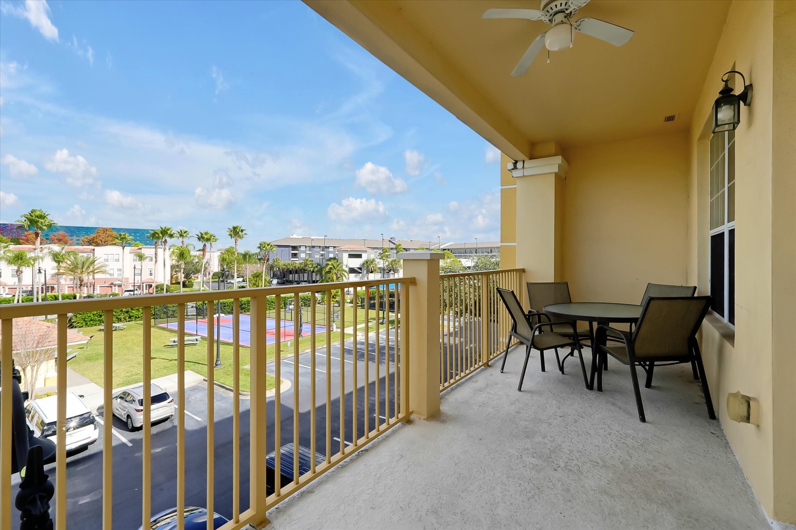 Step onto your private balcony and savor morning coffee while taking in tropical views of palm trees and blue skies.