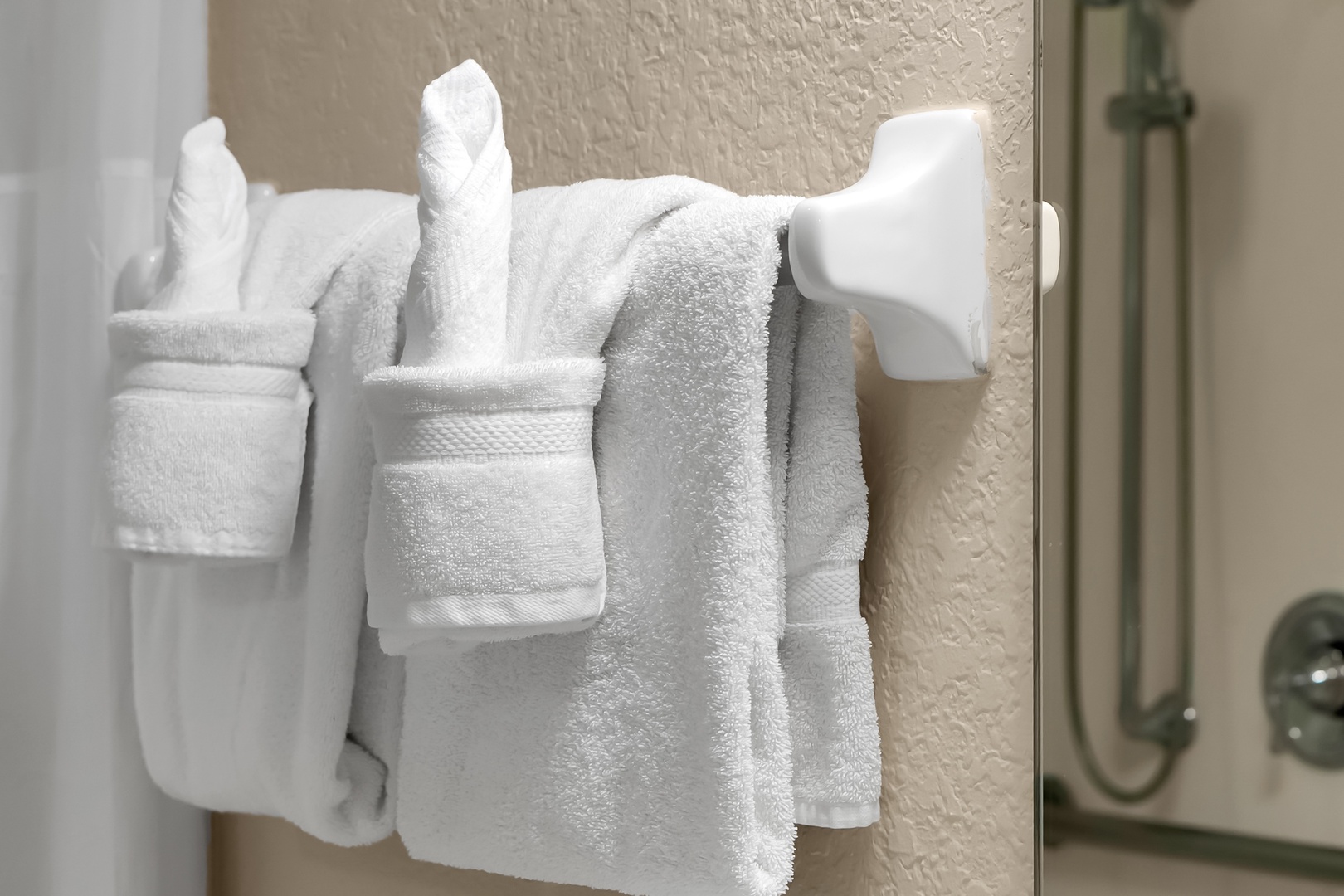 Fresh towels await you, perfectly arranged for your comfort and convenience during your stay.