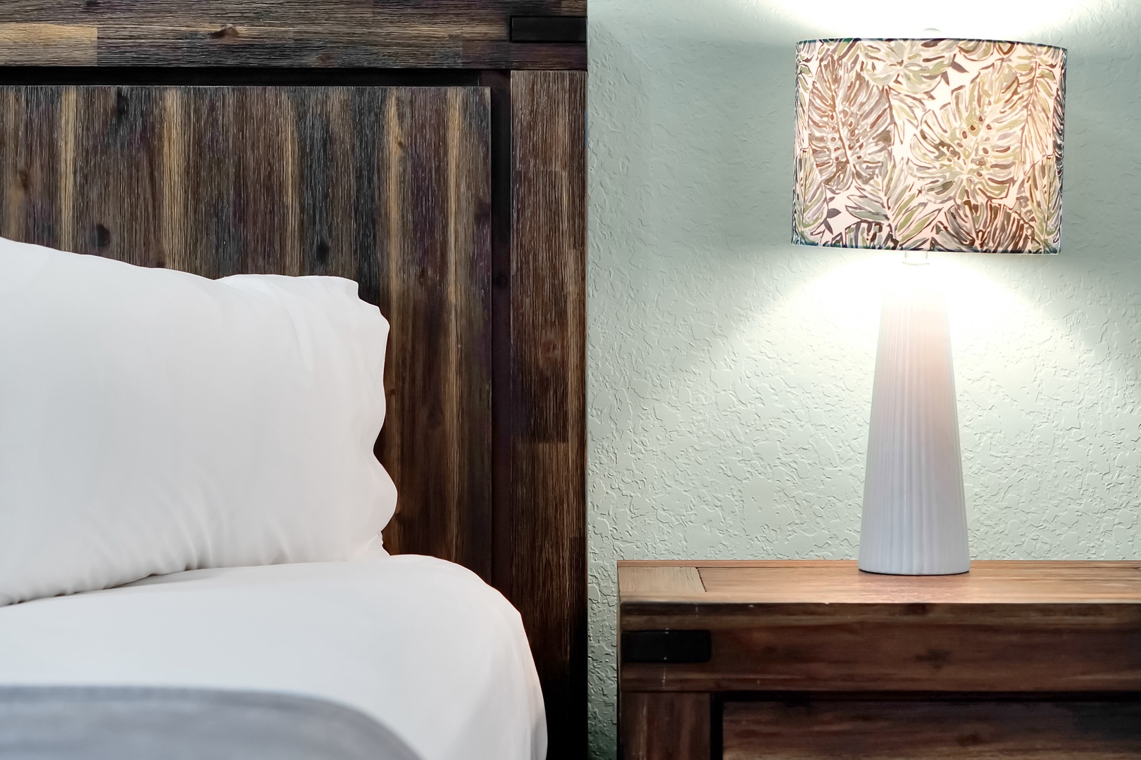 Drift off to sleep in this cozy bedroom featuring rustic wood details and soft linens that wrap you in comfort.