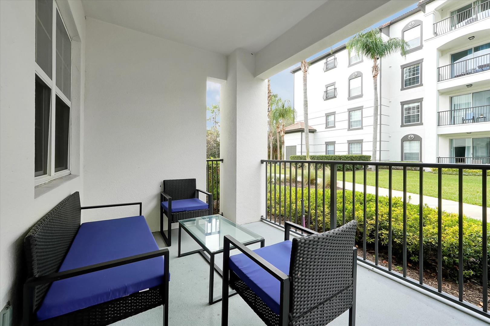 Unwind on your private balcony with comfortable seating and peaceful garden views.