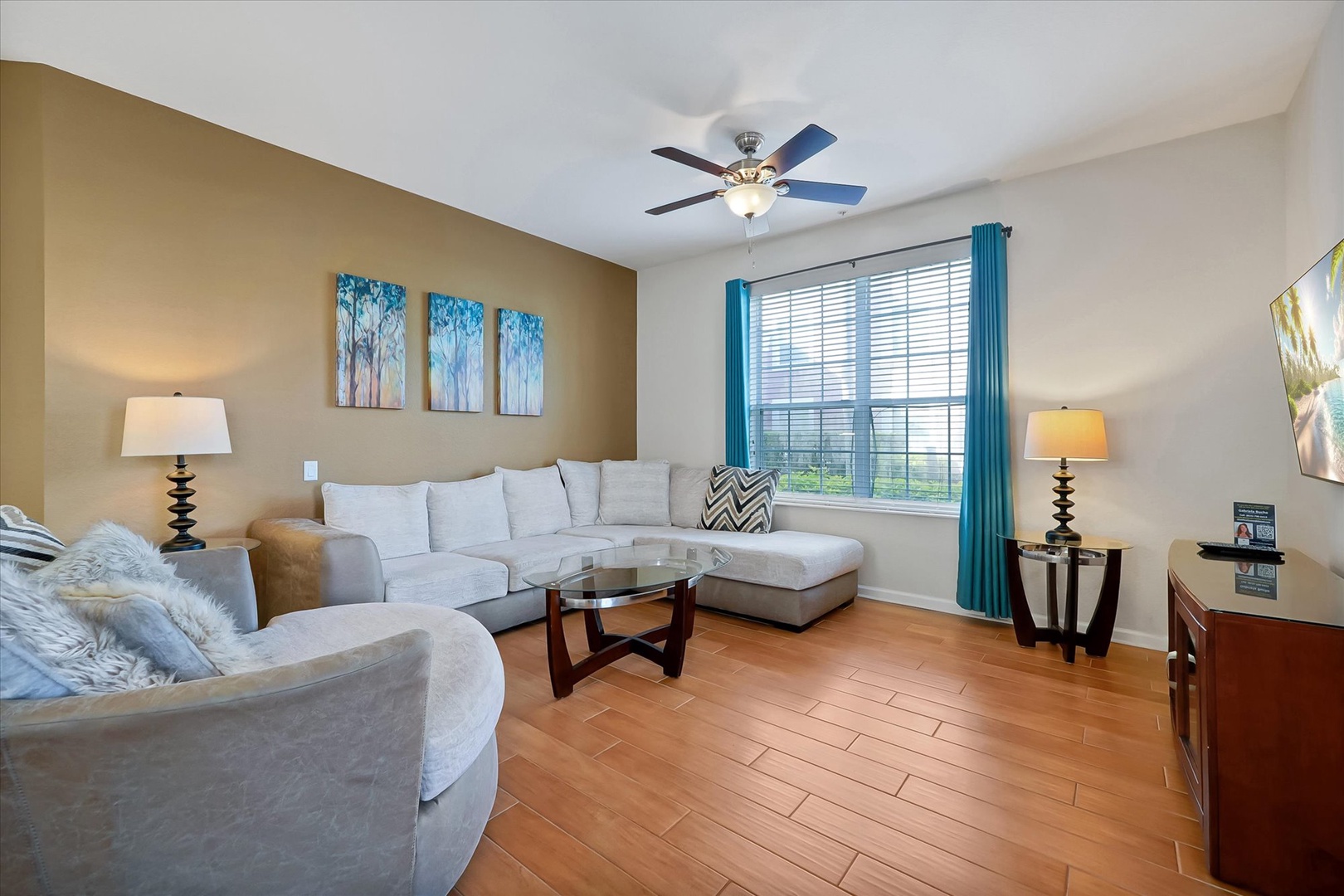 Unwind in your stylish living room with plush sectional seating, perfect for relaxing after exploring the area.