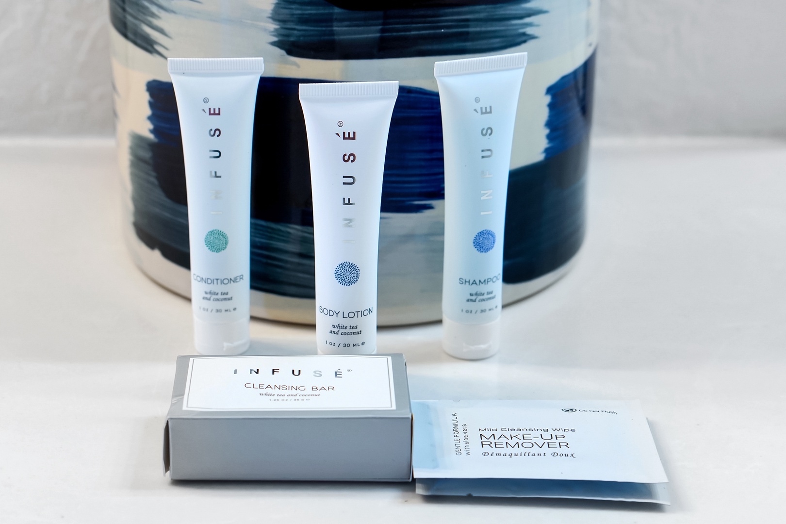 The Infuse amenity collection awaits in your guest bathroom, featuring eco-conscious toiletries packaged with white tea and coconut scents to refresh you after exploring the area.