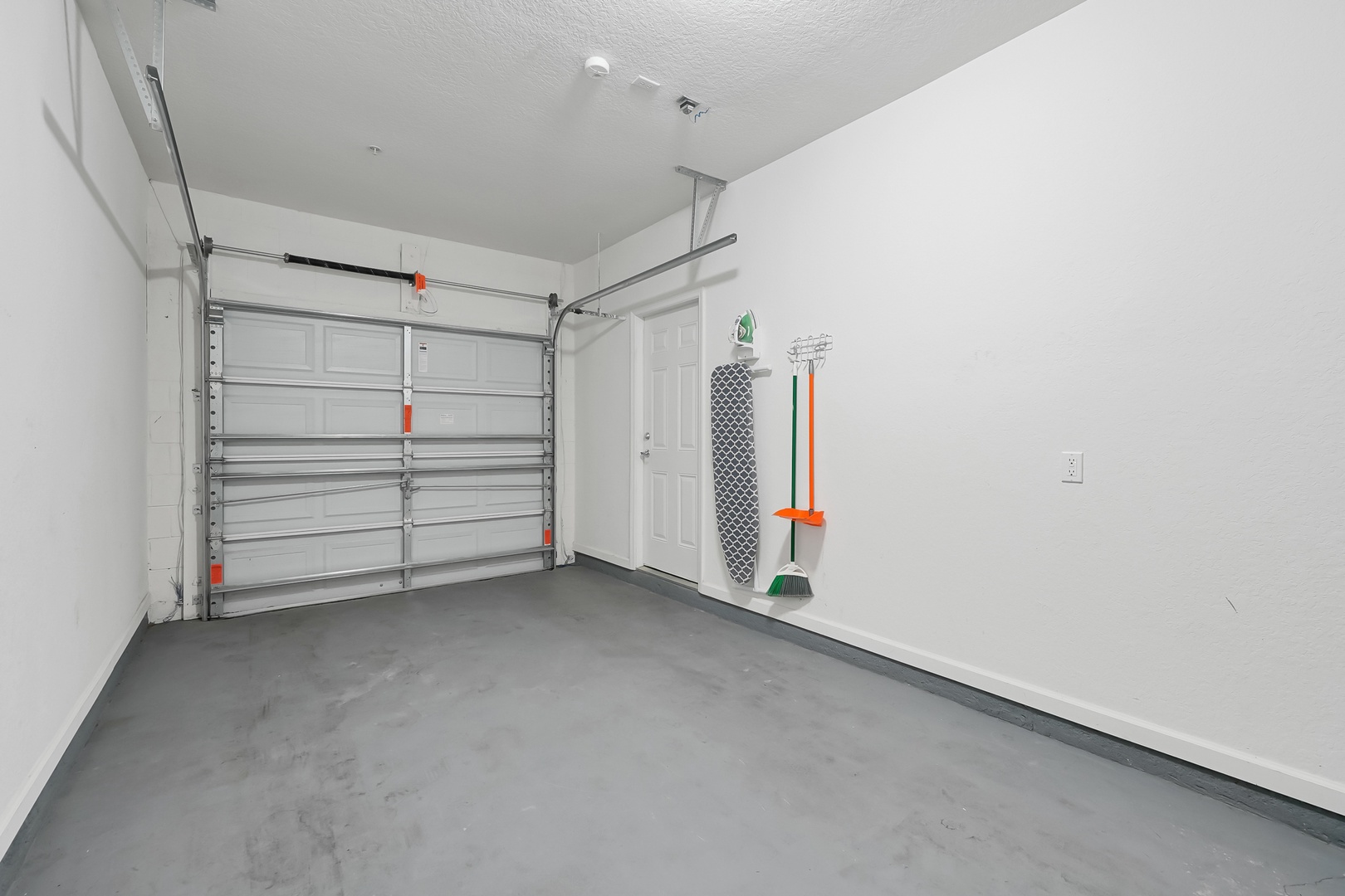 Clean garage space with convenient storage for your beach gear and vacation equipment.