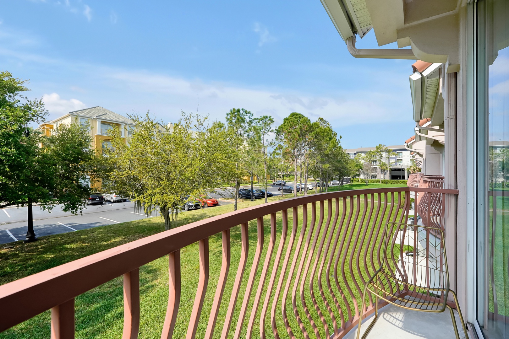 Step onto your private balcony and breathe in the fresh air while enjoying peaceful neighborhood views through the trees.