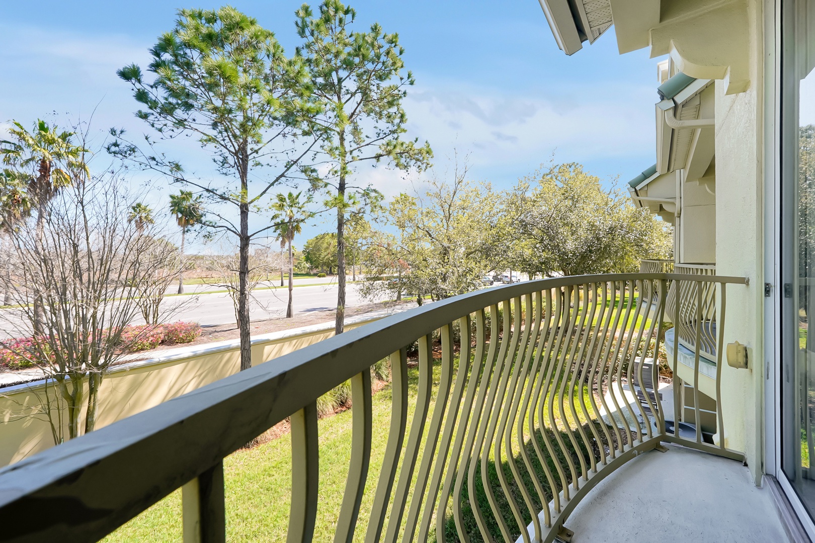 Step onto your private balcony and breathe in the fresh air while taking in peaceful tree-lined views of the quiet neighborhood below.