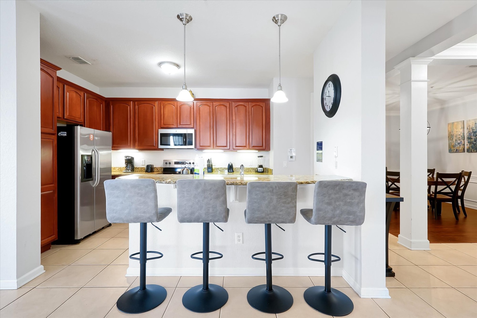 Your fully equipped kitchen features warm cherry cabinets, granite counters, and modern appliances - perfect for cooking memorable meals together.