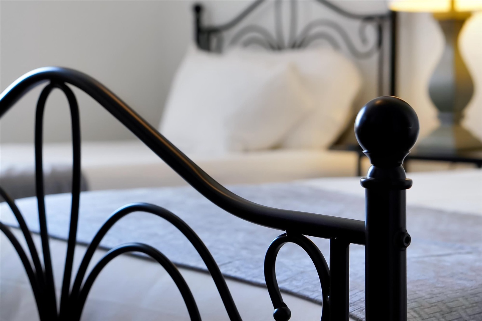 Sink into this elegant room where intricate metalwork meets comfort, creating your perfect thoughtfully designed bedroom.