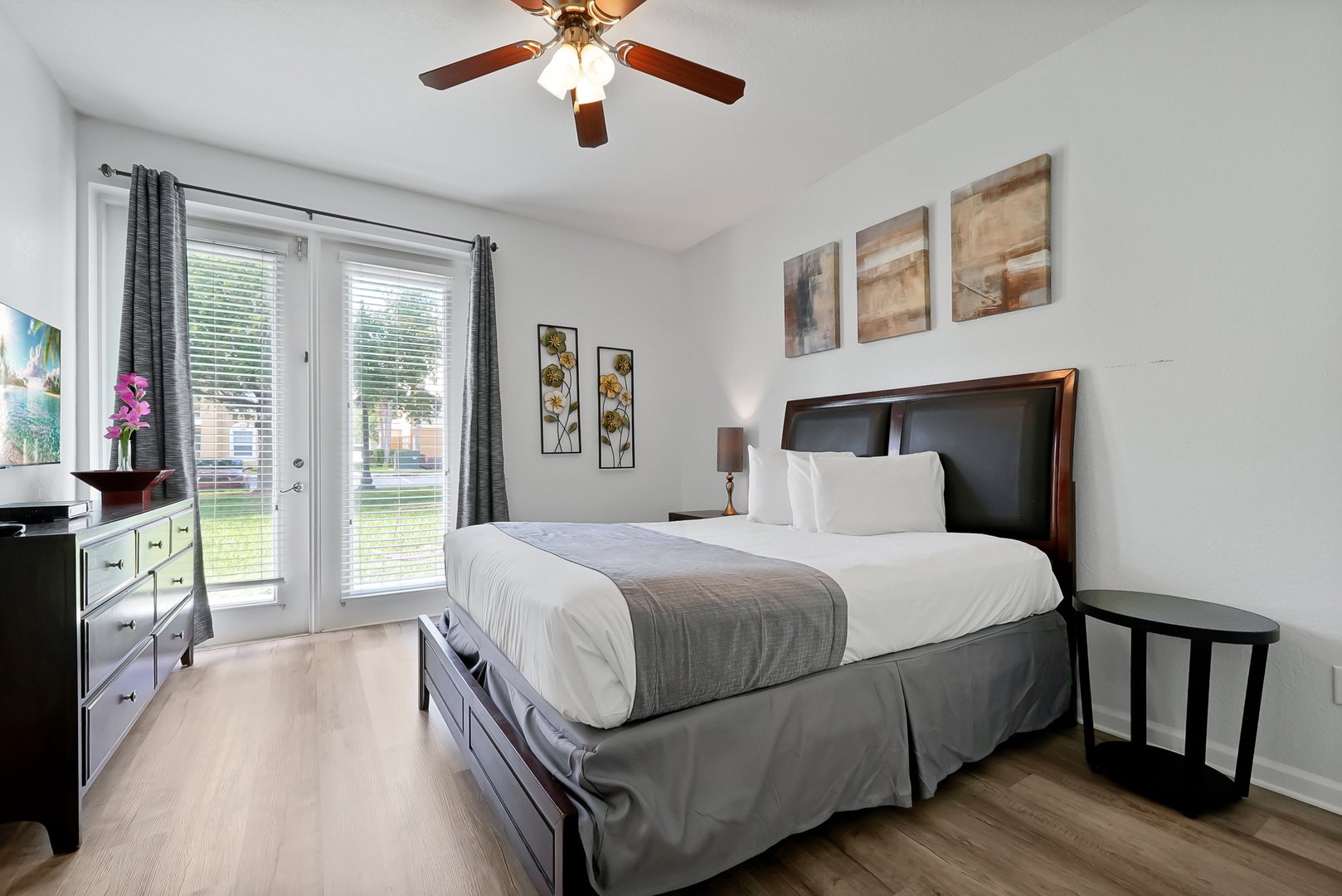 Relax in your bright bedroom with crisp linens, modern furnishings, and private patio access for morning coffee or evening unwinding.
