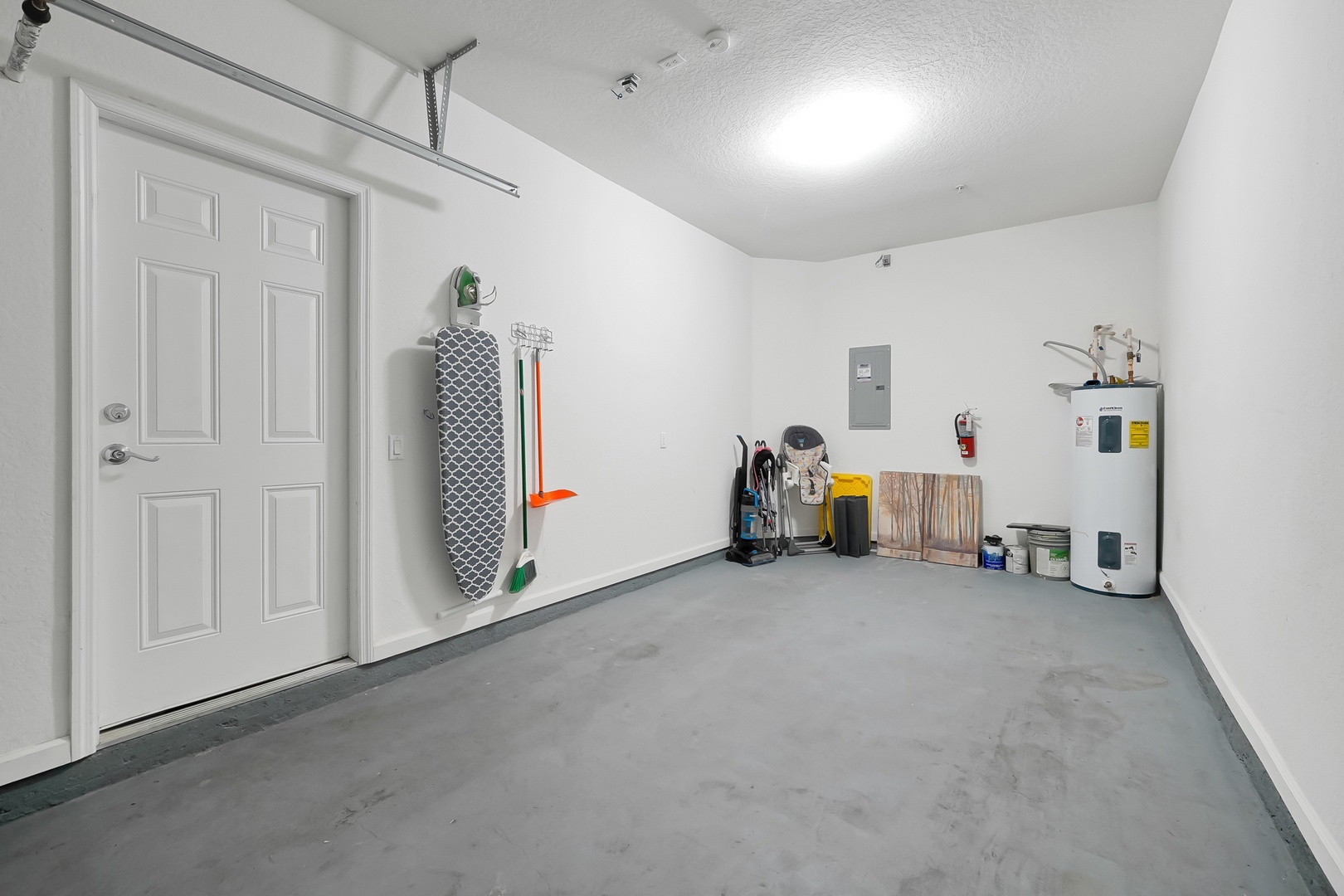 Spacious private garage with convenient storage solutions and direct access to your vacation home.