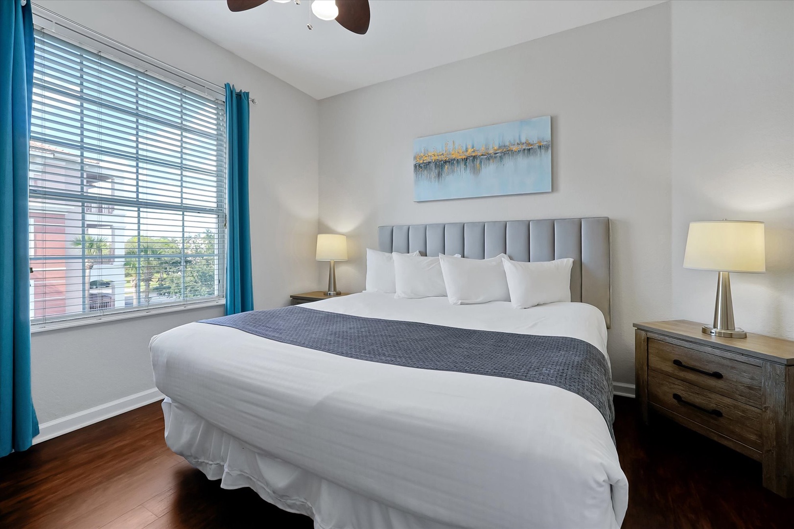 Sink into crisp linens and enjoy morning light through your window in this peaceful bedroom sanctuary.