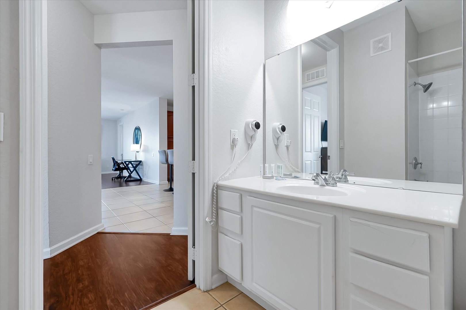 Freshen up in your private bathroom with dual sinks, perfect for couples or families sharing the space.