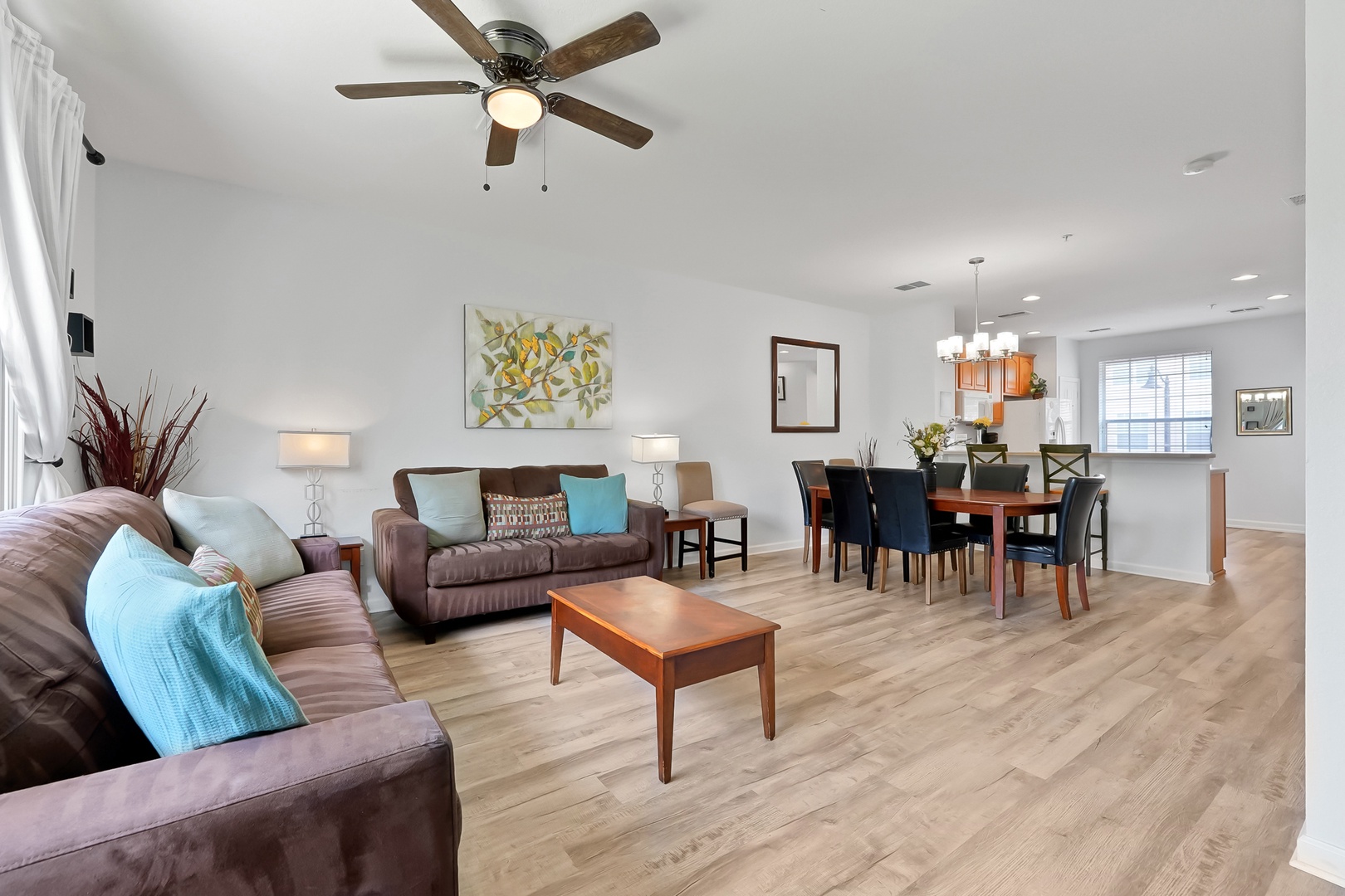 Relax in your spacious open-concept haven with plush seating, elegant dining, and warm wood floors that invite barefoot mornings.