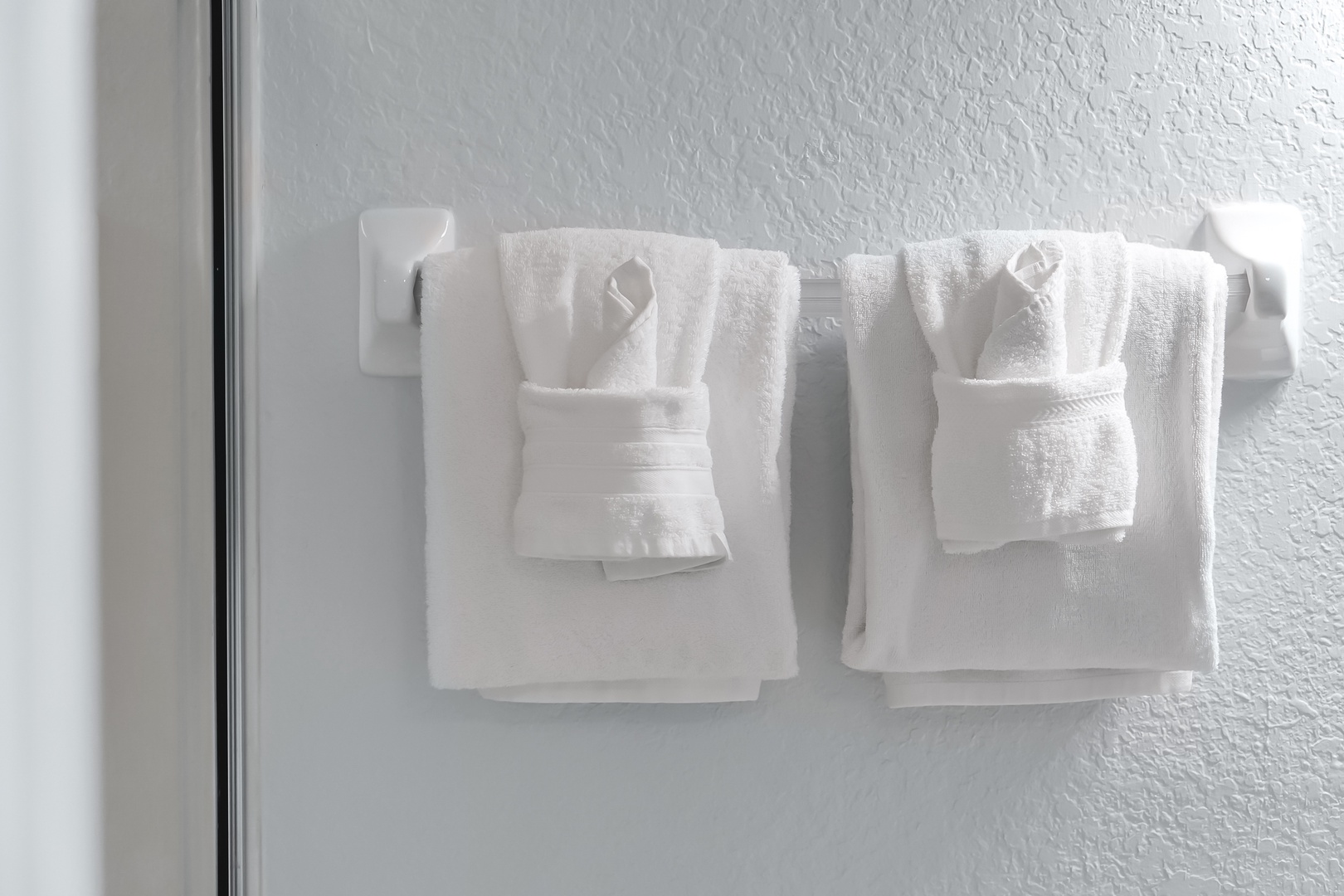 Fresh, fluffy towels await your arrival, perfectly arranged for your comfort and convenience.